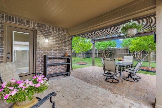 view of patio / terrace with a fenced backyard, outdoor dining space, and a pergola