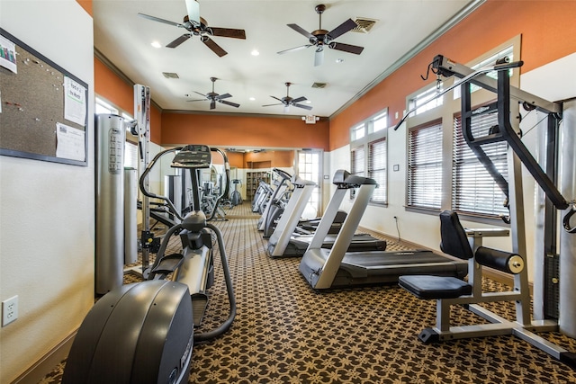 exercise room with baseboards, ornamental molding, recessed lighting, and visible vents