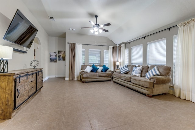 living area with visible vents, lofted ceiling, baseboards, a ceiling fan, and light tile patterned floors