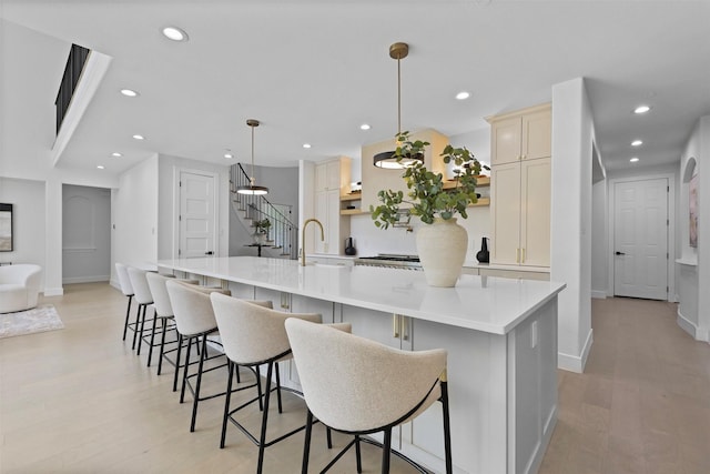 1750 Greenwood Ct, Prosper, TX 75078 - kitchen featuring a sink, light wood-type flooring, and recessed lighting