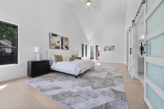 1750 Greenwood Ct, Prosper, TX 75078 - bedroom with baseboards, high vaulted ceiling, ceiling fan, and a barn door
