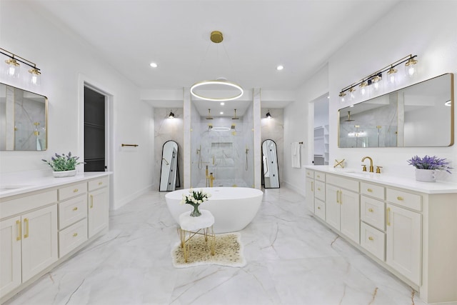 1750 Greenwood Ct, Prosper, TX 75078 - bathroom featuring two vanities, a sink, a freestanding bath, marble finish floor, and a walk in shower