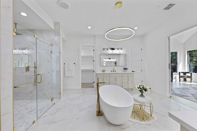 1750 Greenwood Ct, Prosper, TX 75078 - full bathroom with recessed lighting, marble finish floor, a freestanding bath, a marble finish shower, and baseboards