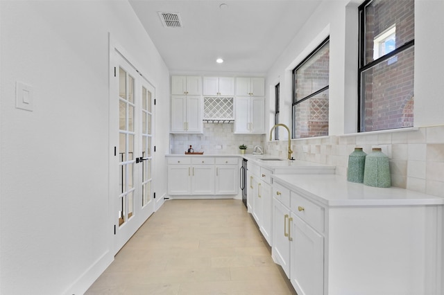 1750 Greenwood Ct, Prosper, TX 75078 - kitchen with white cabinets, recessed lighting, backsplash, visible vents, and a sink