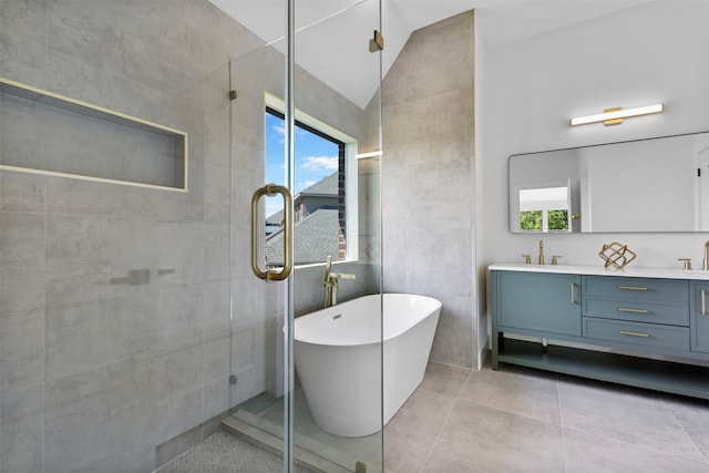 1750 Greenwood Ct, Prosper, TX 75078 - full bathroom featuring a tile shower, lofted ceiling, a freestanding bath, double vanity, and a sink