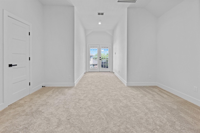 1750 Greenwood Ct, Prosper, TX 75078 - empty room featuring visible vents, french doors, carpet flooring, and vaulted ceiling