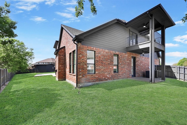 1750 Greenwood Ct, Prosper, TX 75078 - back of property with a balcony, a lawn, a fenced backyard, brick siding, and ceiling fan