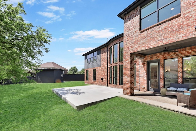 1750 Greenwood Ct, Prosper, TX 75078 - back of property featuring brick siding, a yard, a patio area, and an outdoor living space