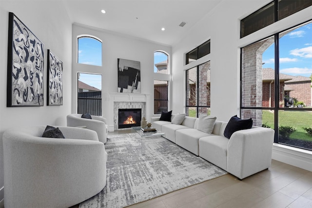 1750 Greenwood Ct, Prosper, TX 75078 - living area with a wealth of natural light, visible vents, and a premium fireplace