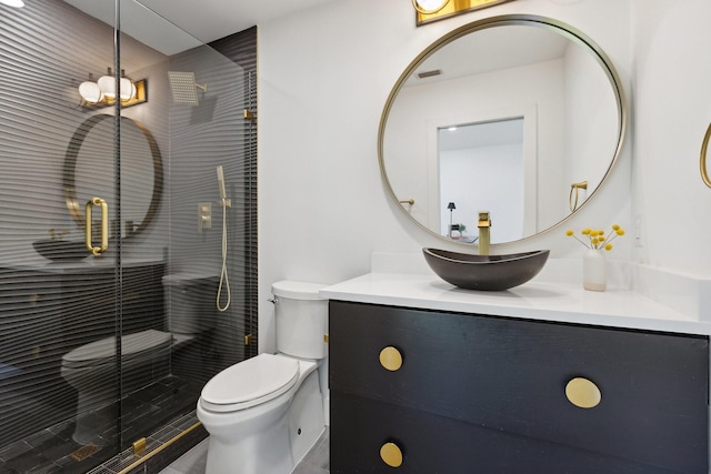 full bath featuring toilet, vanity, and a stall shower