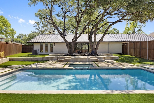 view of swimming pool with a fenced backyard, cooling unit, a patio, and a pool with connected hot tub