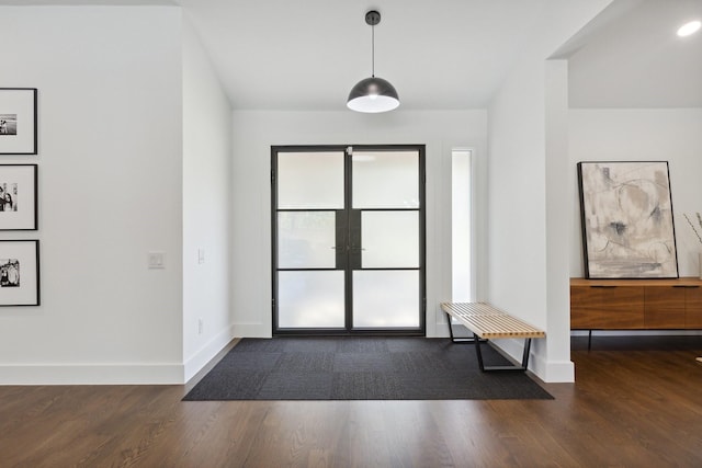entryway with baseboards and dark wood-style floors