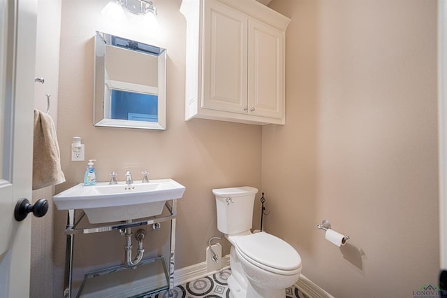 225 Clements Cir, Tatum, TX 75691 - half bathroom with baseboards and toilet