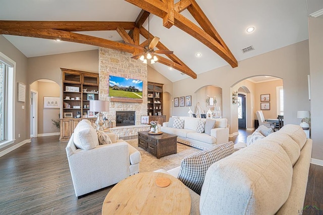 225 Clements Cir, Tatum, TX 75691 - living room featuring arched walkways, plenty of natural light, and visible vents