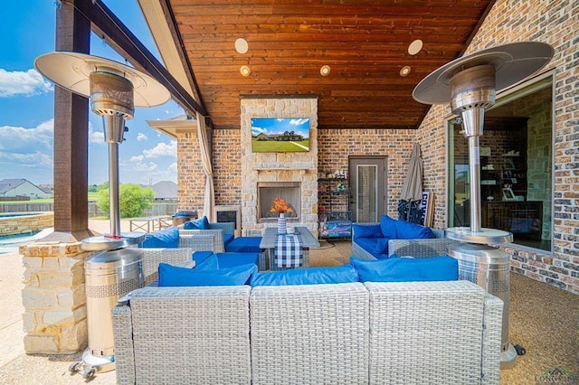 225 Clements Cir, Tatum, TX 75691 - view of patio featuring an outdoor living space with a fireplace