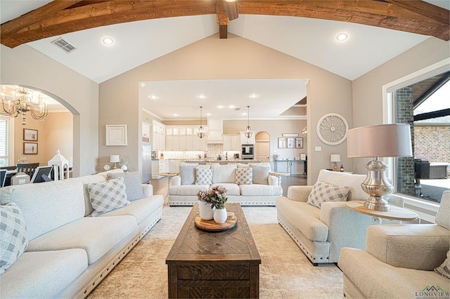 225 Clements Cir, Tatum, TX 75691 - living room featuring recessed lighting, visible vents, vaulted ceiling with beams, arched walkways, and a chandelier