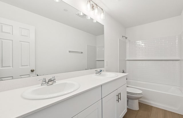 7200 Pederson Creek Way, Denton, TX 76208 - bathroom with toilet, double vanity, shower / bath combination, and wood finished floors