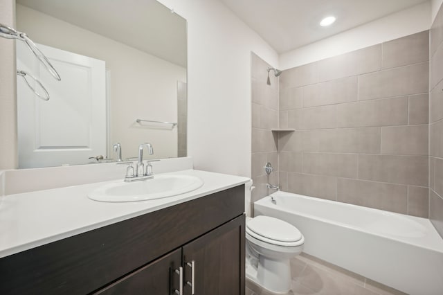bathroom featuring recessed lighting, tile patterned flooring, toilet, vanity, and  shower combination