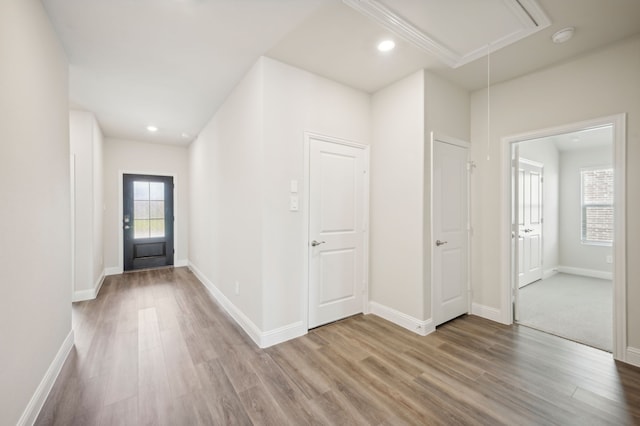 interior space featuring recessed lighting, wood finished floors, and baseboards