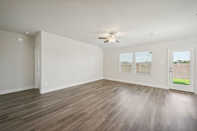 unfurnished living room featuring ceiling fan, baseboards, and dark wood-style floors