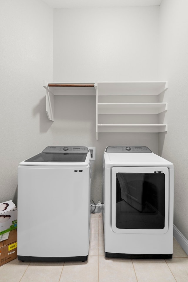 4717 Whitehall Ct, Mckinney, TX 75070 - laundry area with washing machine and dryer and light tile patterned flooring