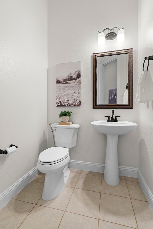 4717 Whitehall Ct, Mckinney, TX 75070 - half bathroom featuring tile patterned flooring, toilet, and baseboards