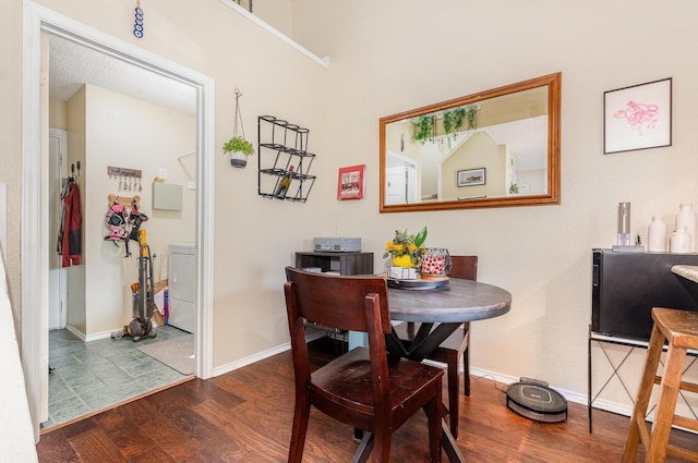 5200 Martel Ave Unit 35C, Dallas, TX 75206 - dining room with washer / clothes dryer, wood finished floors, and baseboards