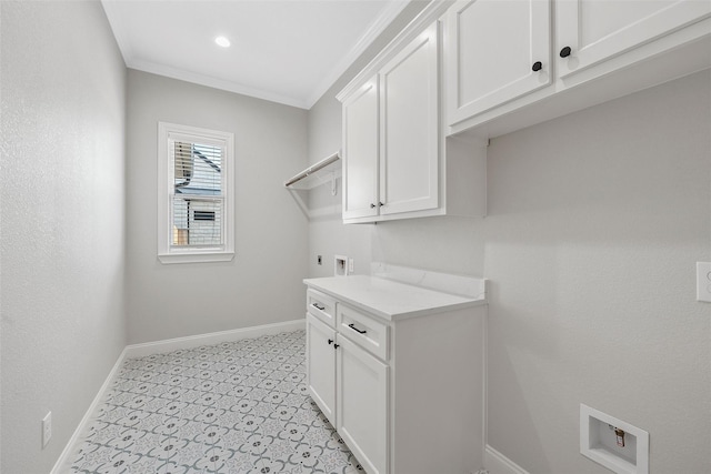 washroom featuring hookup for an electric dryer, cabinet space, baseboards, ornamental molding, and washer hookup