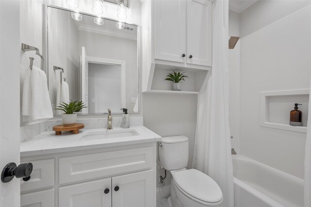 bathroom featuring shower / tub combo, vanity, and toilet