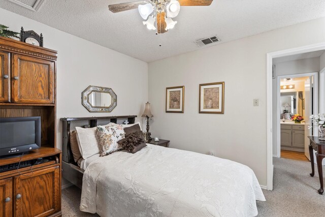 carpeted bedroom with ceiling fan, baseboards, and visible vents