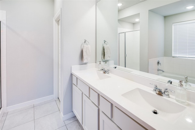 3504 Periwinkle Dr, Aubrey, TX 76227 - bathroom with a stall shower, tile patterned floors, baseboards, and double vanity
