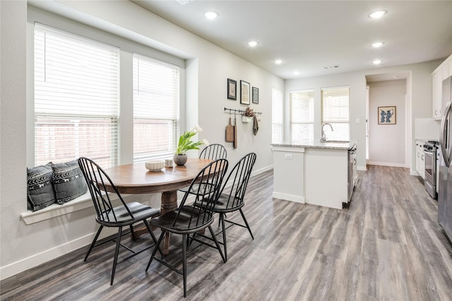 3504 Periwinkle Dr, Aubrey, TX 76227 - dining space with baseboards, wood finished floors, and recessed lighting