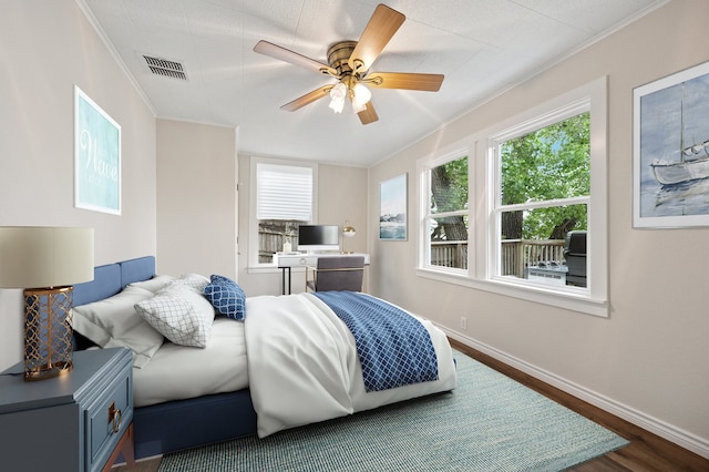 6725 Cahoba Dr, Fort Worth, TX 76135 - bedroom with ceiling fan, visible vents, baseboards, dark wood-style floors, and ornamental molding