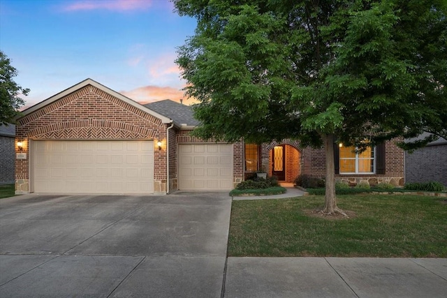 6514 Eagle Rock Dr, Frisco, TX 75036 - view of front of house with brick siding, an attached garage, a front yard, and concrete driveway