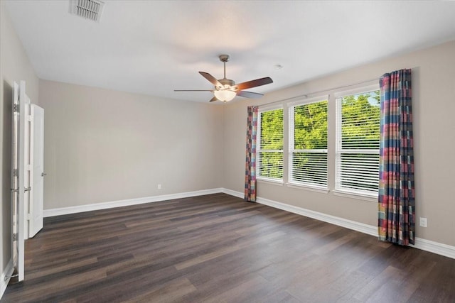 6514 Eagle Rock Dr, Frisco, TX 75036 - unfurnished room featuring baseboards, visible vents, ceiling fan, and dark wood-style flooring