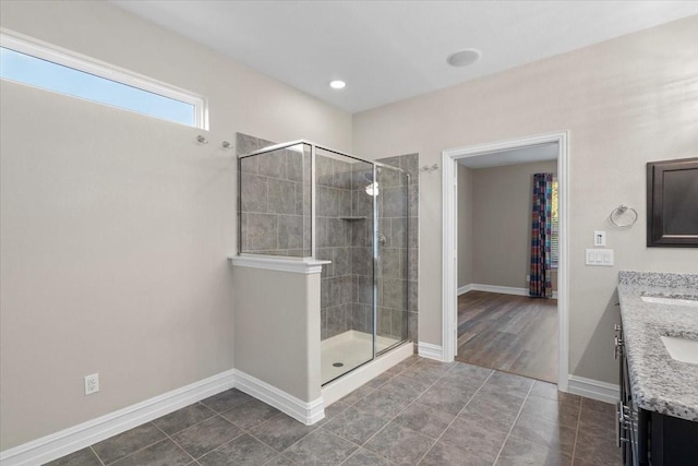 6514 Eagle Rock Dr, Frisco, TX 75036 - bathroom featuring baseboards, vanity, a shower stall, and tile patterned floors