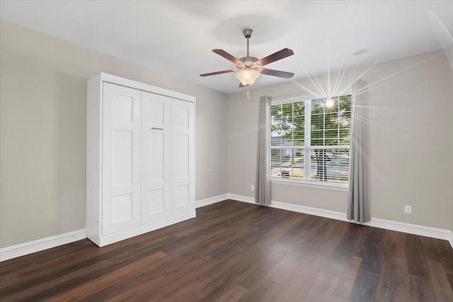 6514 Eagle Rock Dr, Frisco, TX 75036 - unfurnished bedroom with ceiling fan, baseboards, dark wood-style flooring, and a closet