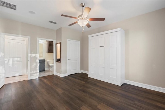 6514 Eagle Rock Dr, Frisco, TX 75036 - unfurnished bedroom with baseboards, visible vents, and dark wood-type flooring