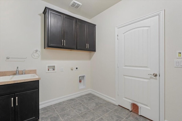 6514 Eagle Rock Dr, Frisco, TX 75036 - washroom featuring visible vents, a sink, gas dryer hookup, hookup for a washing machine, and cabinet space