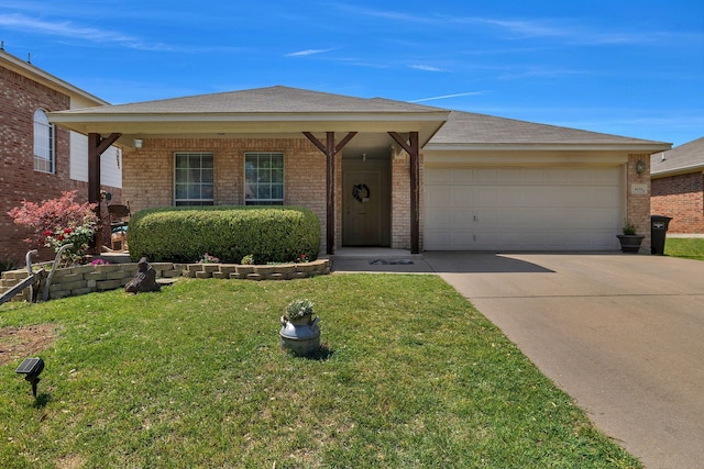 6121 Bowfin Dr, Fort Worth, TX 76179 - view of front of home featuring an attached garage, a front lawn, brick siding, and concrete driveway