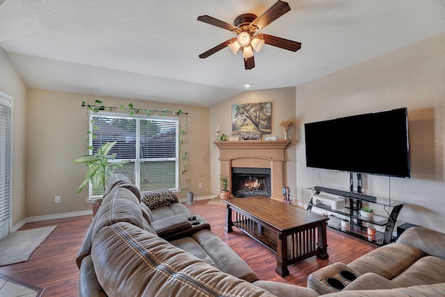 6121 Bowfin Dr, Fort Worth, TX 76179 - living area featuring baseboards, a ceiling fan, a lit fireplace, and wood finished floors