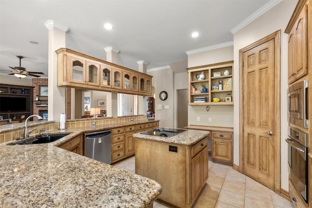 kitchen with stainless steel appliances, a ceiling fan, a sink, a center island, and glass insert cabinets