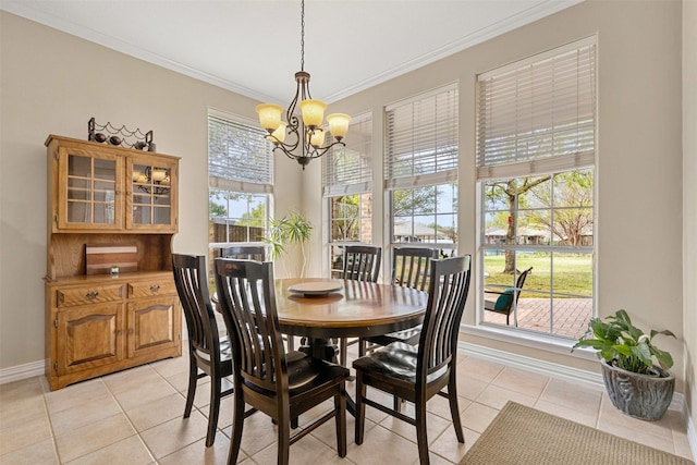 dining area with baseboards, a chandelier, light tile patterned floors, and crown molding
