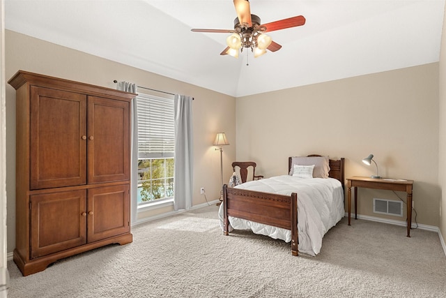 bedroom with light colored carpet, baseboards, vaulted ceiling, and visible vents