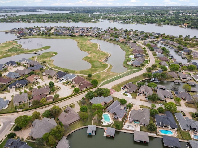 birds eye view of property featuring a water view and a residential view