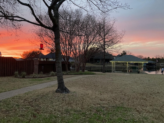 view of yard featuring fence and a gazebo