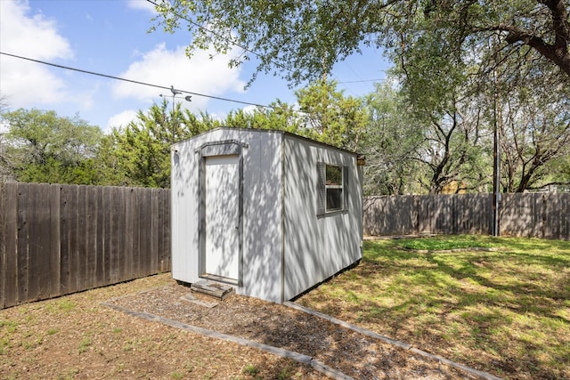 view of shed featuring a fenced backyard