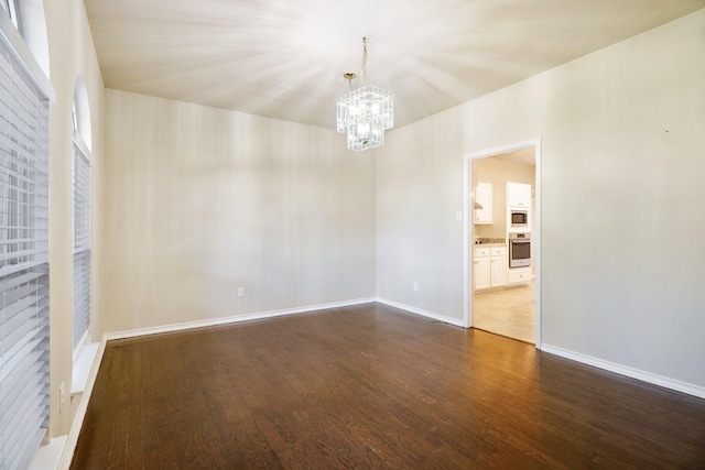 803 Sterling Ct, Allen, TX 75002 - unfurnished room featuring a chandelier, dark wood-style floors, and baseboards