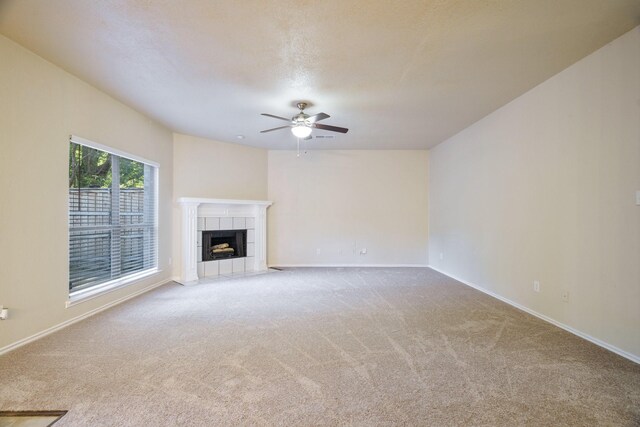 803 Sterling Ct, Allen, TX 75002 - unfurnished living room featuring ceiling fan, carpet, baseboards, and a tiled fireplace