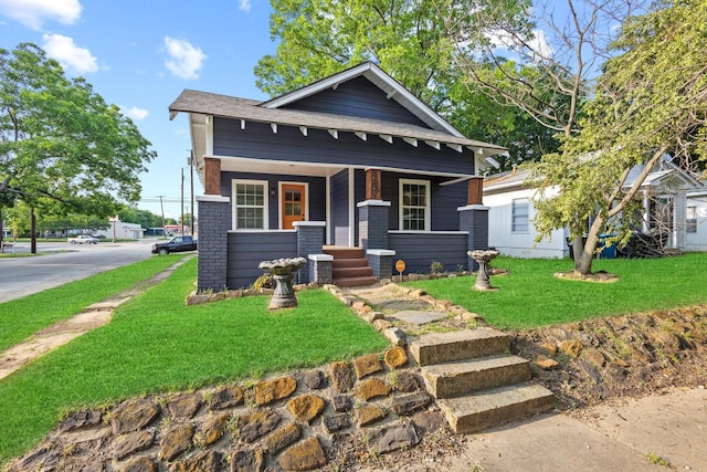 1031 W Chestnut St, Denison, TX 75020 - view of front of property featuring a front yard and a porch